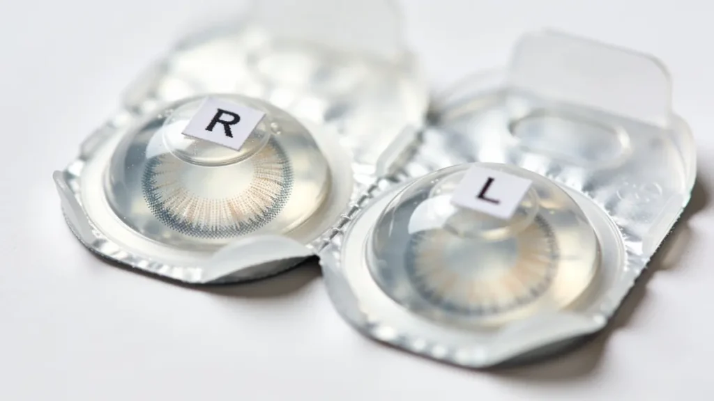contact lens blister packs labeled R and OS for right and left eye identification